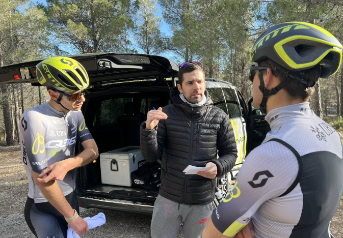 Carles Tur, Head Coach of Q36.5 Pro Cycling Team, advising an athletes.