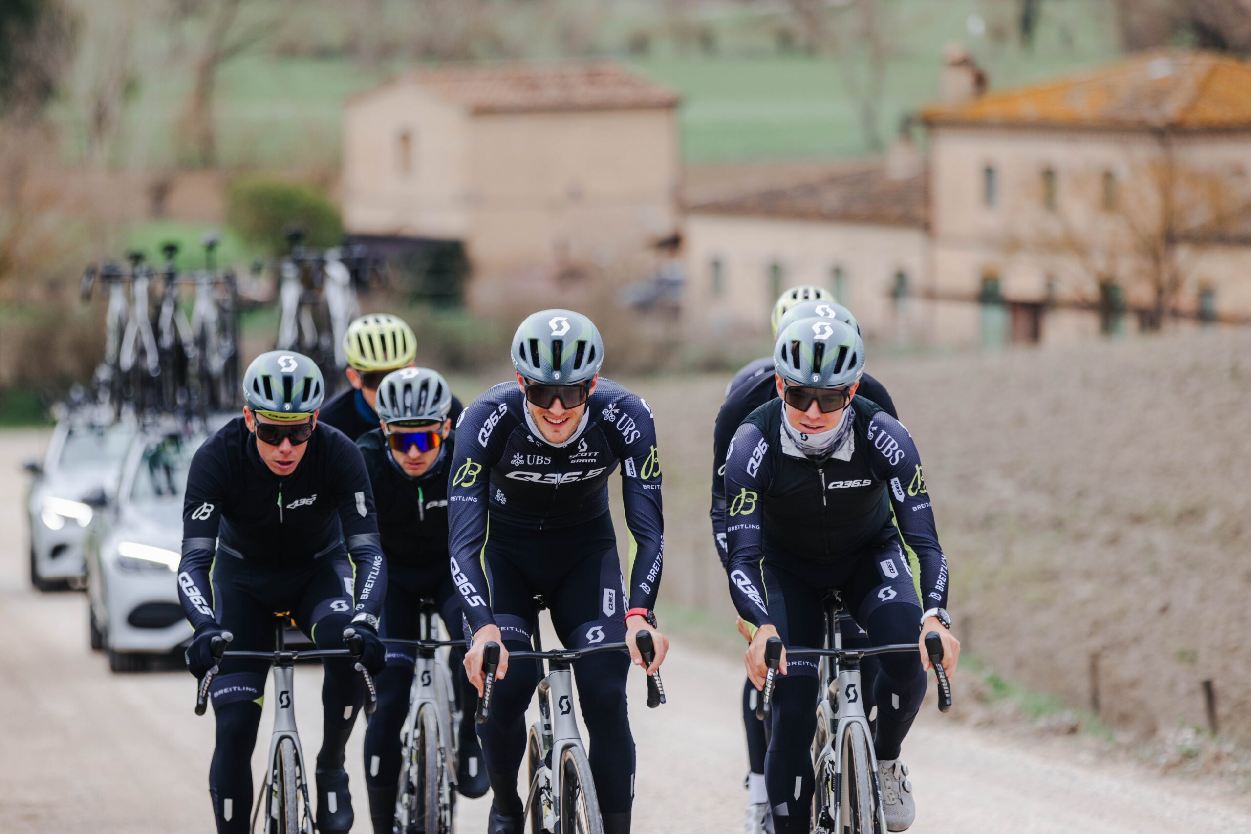 Q36.5 Pro Cycling Team riders in formation during Strade Bianche course recon.